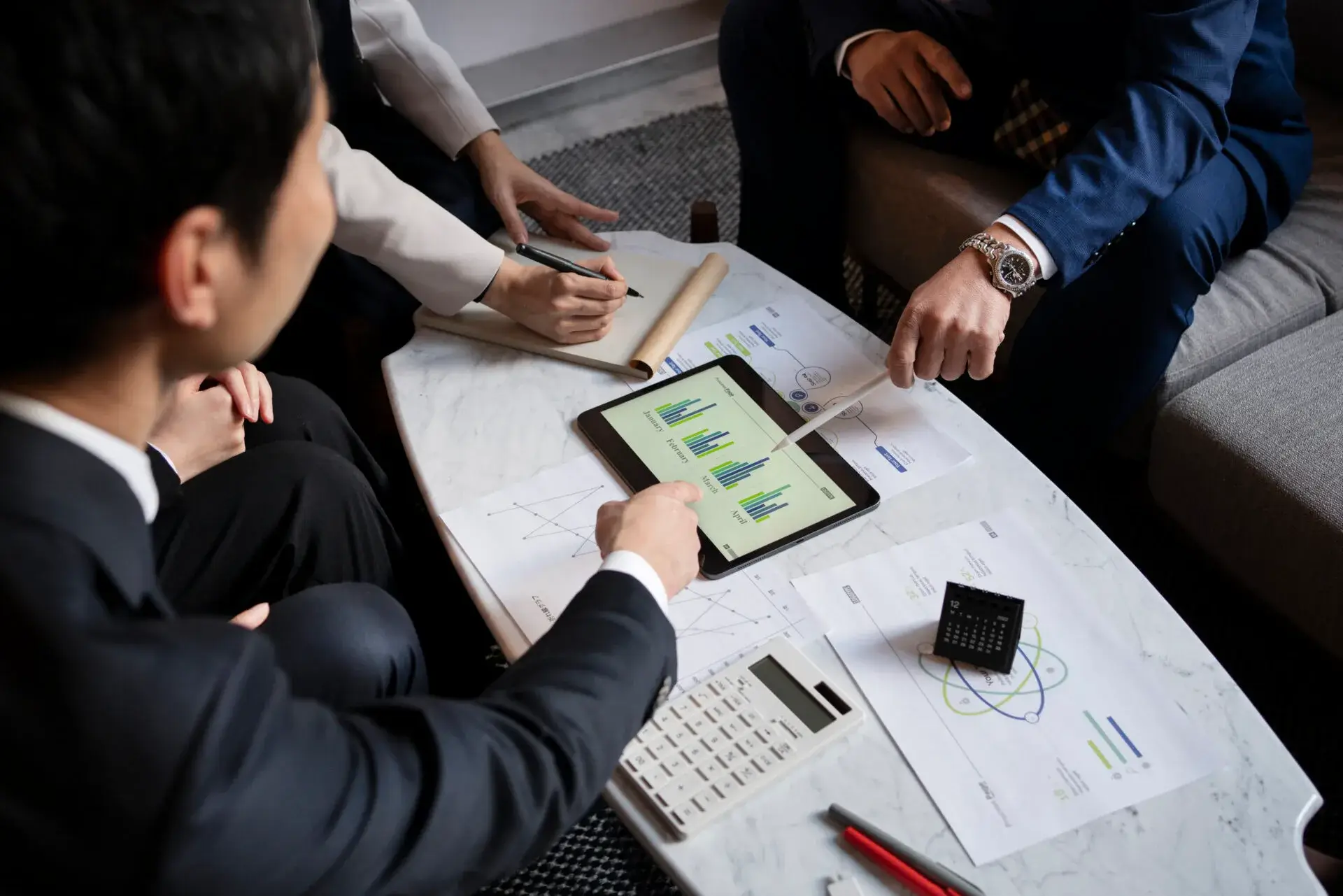 Business team working on iPad