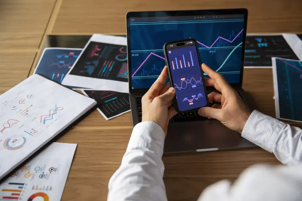 Office team analyzing financial graphs and data